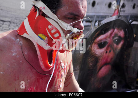 Sao Paulo, Brazil. 31st Juky 2018. PROTEST AGAINST ANIMAL TESTS: Activist of the NGO Veddas (Ethical Vegetarianism, Defense of the Animal Rights and Society) protest against the animal tests. Activist passes tests against animals, ingests fabric softener among other tortures. The act happened on Avenida Paulista in SÃ£o Paulo. Credit: Cris Faga/ZUMA Wire/Alamy Live News Stock Photo