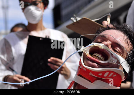 Sao Paulo, Brazil. 31st Juky 2018. PROTEST AGAINST ANIMAL TESTS: Activist of the NGO Veddas (Ethical Vegetarianism, Defense of the Animal Rights and Society) protest against the animal tests. Activist passes tests against animals, ingests fabric softener among other tortures. The act happened on Avenida Paulista in SÃ£o Paulo. Credit: Cris Faga/ZUMA Wire/Alamy Live News Stock Photo