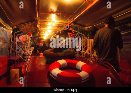 Bangkok, Thailand - May 1, 2018: Interiors of the express boat driving through one of the channels of Bangkok Stock Photo