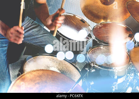 Drummer playing the drumset.Music and entertainment concept.Percussion sound recording in studio.Music band and musician on stage Stock Photo