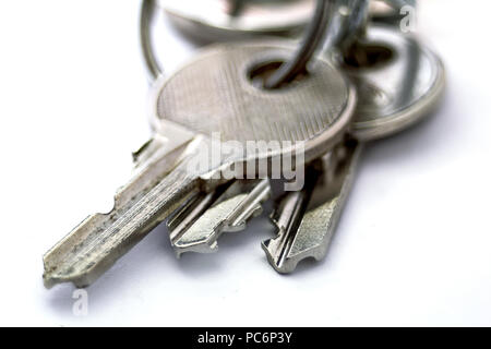 Small old keys isolated macro on white background Stock Photo