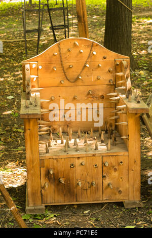 medieval torture wood spear chair replica displayed in Ploiesti, Romania at the Medieval Festival. Stock Photo