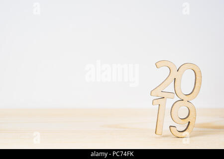 Business and design concept - wooden word " 2019 " on table and white background Stock Photo
