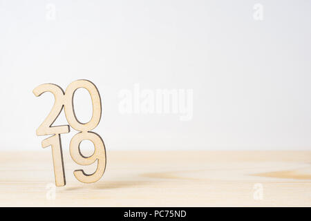 Business and design concept - wooden word " 2019 " on table and white background Stock Photo