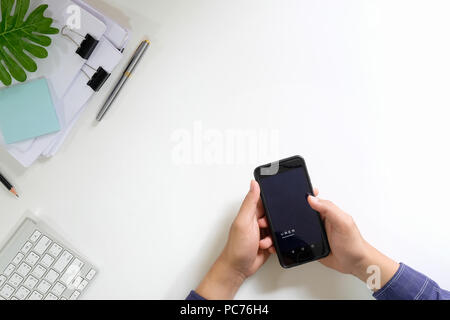 CHIANG MAI,THAILAND - JUNE 26, 2018 : A man hand holding Facebook 