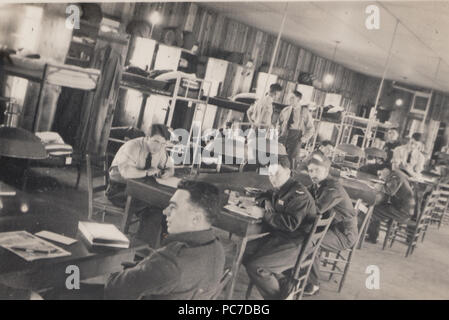 Vintage Photograph of Military Personnel in Their Barracks. Appear To Be Royal Air Force Men. Stock Photo