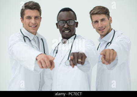 multinational group of doctors pointing at you Stock Photo