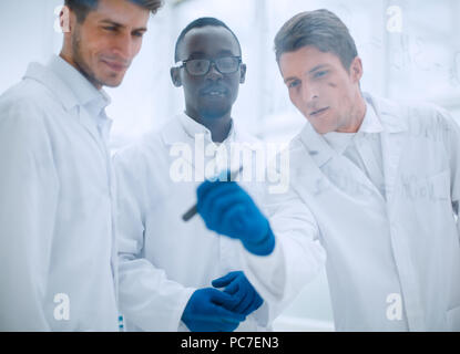 promising scientist makes notes on the Board Stock Photo