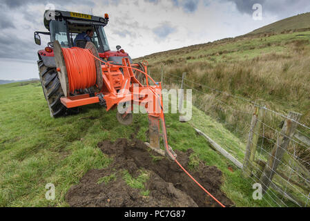Work taking place to instal the World's fastest rural broadband in the farmland around Chipping, Preston, Lancashire. Offering a full 1,000Mbps, B4RN, Stock Photo