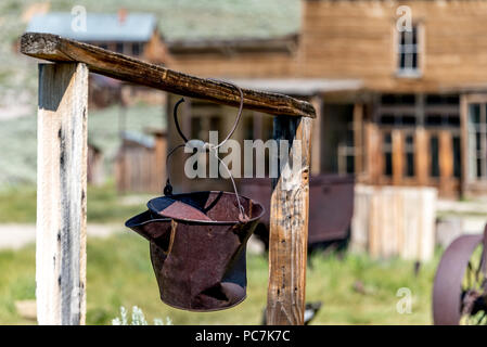 A rusty pail hangs above a one-time well in the abandoned California ghost town of Bodie, now a state historic park in the eastern Sierra Mountains.