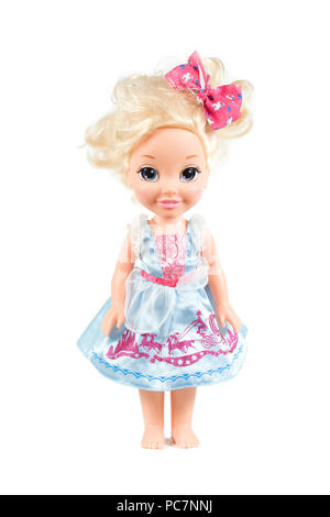 Childs doll in dress with jojo bow in hair Stock Photo