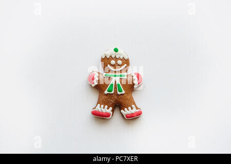Traditional Christmas ginger cookies in the form of ginger little man on a white background. Stock Photo