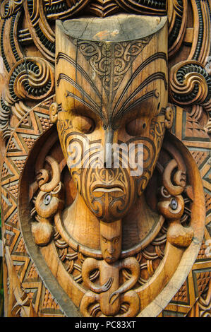 Traditional wood carved mask in the Te Puia Maori Cultural Center, Roturura, North Island, New Zealand Stock Photo