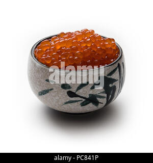 Red salmon caviar in a traditional Japanese cup, isolated on white Stock Photo