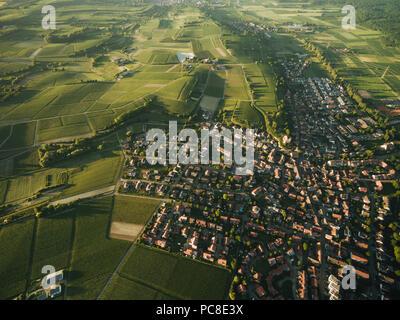 aerial view of small town surrounded with agricultural fields, europe Stock Photo