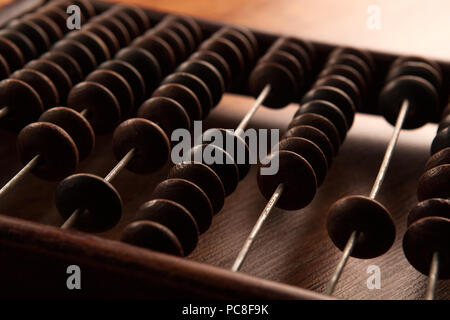 big antique abacus on a wooden table close up Stock Photo