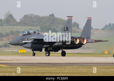 F-15E from the resident 494th Fighter Squadron plugs in the afterburners and rolls on runway 24 at RAF Lakenheath, Suffolk. Stock Photo