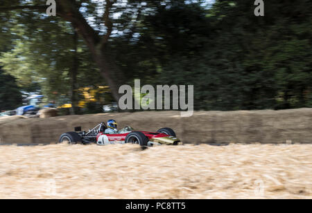 A Formula One car speeds up the Hillclimb at the Goodwood Festival of Speed 2018. Stock Photo