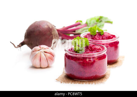 Beetroot  puree in glass jars isolated on white Stock Photo