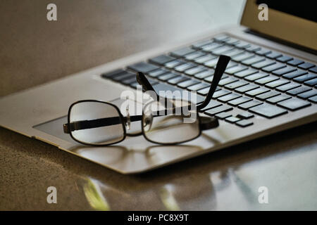 Montreal, Canada, July 31, 2018.Reading glasses on computer keyboard.Credit Mario Beauregard/Ģ����ý Live News Stock Photo