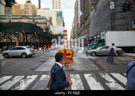 steam leak coming out a temporary chimney at a busy midtown 42nd street in Manhattan Stock Photo