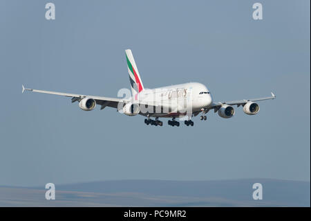 An Emirates Airbus A380-861 comes in to land at Manchester Airport, UK. Stock Photo