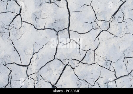 White cracked earth ground background texture Stock Photo - Alamy