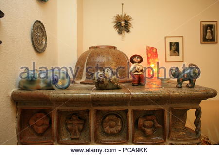 Ceramic tiled stove in a sitting room in Bavaria, Germany. Stock Photo