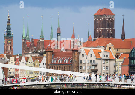 Drawbridge over Motlawa River, Gothic watergate Brama Straganiarska on Dlugie Pobrzeze (Motlawa River Embankment), Gothic Ratusz Glownego Miasta (Main Stock Photo