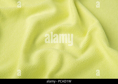 Texture of soft cotton fluffy yellow towel as a beautiful background Stock Photo