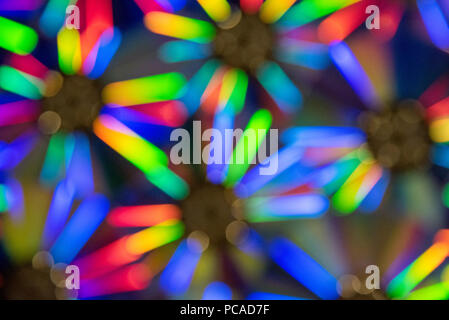Beautiful cool background with a blurred spectrum of rainbow colors in the defocus Stock Photo