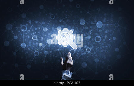 Technology conceptual image with gear digital symbol on dark background Stock Photo