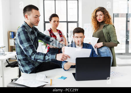 creative team working on user interface at office Stock Photo