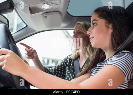 Teenager Having Driving Lesson With Female Instructor Stock Photo