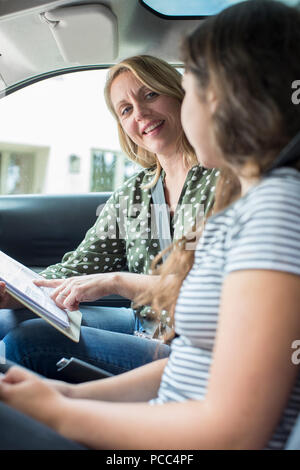 Teenager Having Driving Lesson With Female Instructor Stock Photo