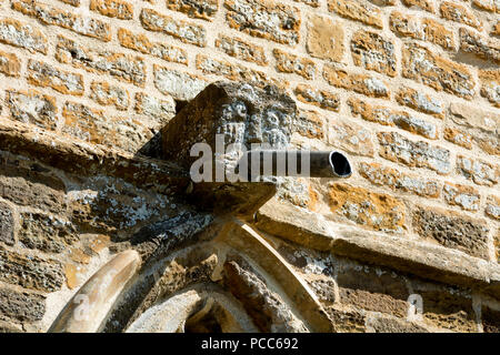A gargoyle on the tower of St Michael and All Angels Church, Creaton, Northamptonshire, England, UK Stock Photo