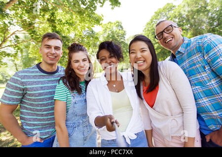 group of happy international friends taking selfie Stock Photo