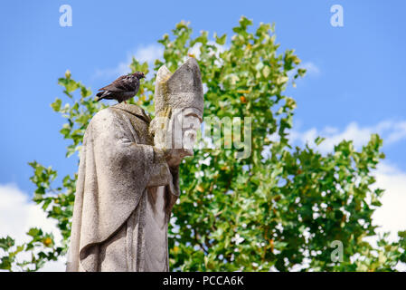 Statue of Saint Denis Holding his Head Stock Photo