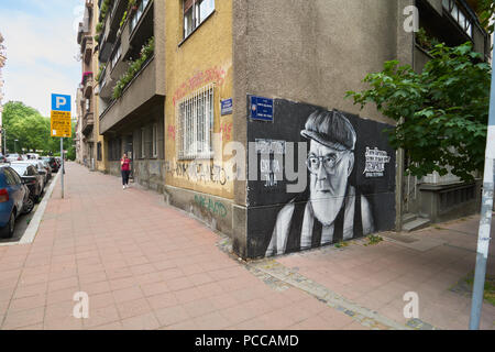 Belgrade, Serbia - May 04, 2018: Outdoor art on Gospodar Jovanova street. Young woman walks on the street and speaks on the phone. Stock Photo