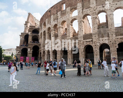 People walking around the walls of the Colosseum, Rome, Italy Stock Photo