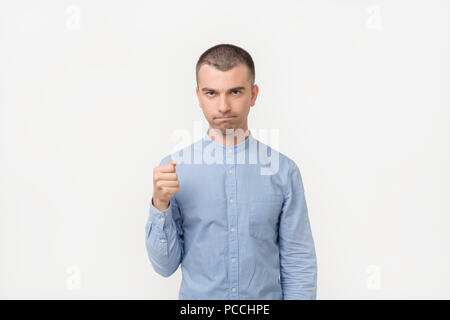 Hispanic man in blue shirt holding his fist waiting his partner give him five back. Stock Photo
