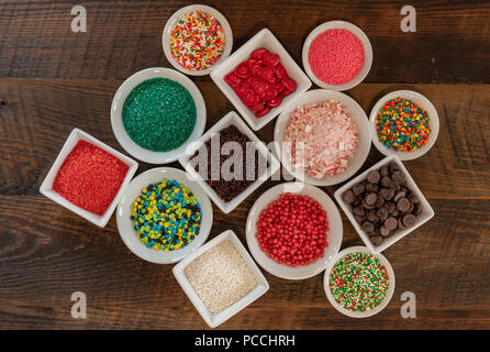Random Spread of Sprinkles in white ceramic bowls Stock Photo