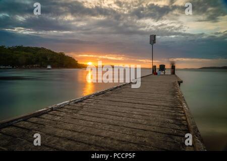 Stunning sunset from Little beach pier in Port Stephens Stock Photo