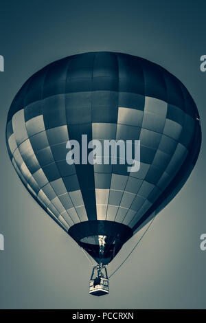 Duotone images of flying hot-air balloons at a Northamptonshire balloon festival Stock Photo