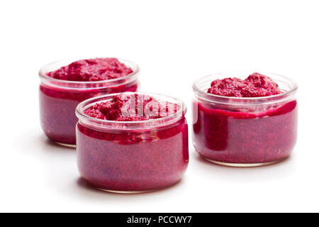 Beetroot  puree in glass jars isolated on white Stock Photo