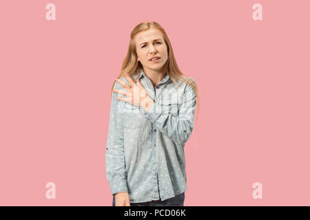 Young woman overwhelmed with a pain in the shoulder Stock Photo