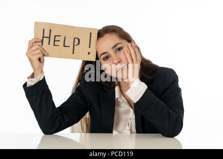 Young attractive frustrated and tired latin businesswoman holding help sign message exhausted, sad under pressure and stress isolated on white in unem Stock Photo