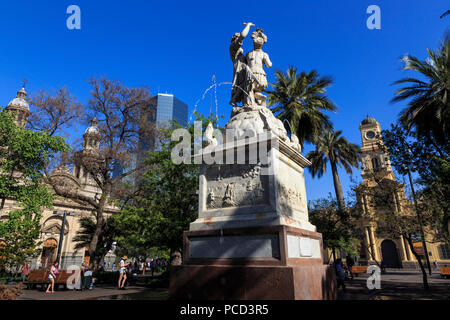 Simon Bolivar liberator fountain, lush trees, blue sky, Plaza de Armas, Santiago Centro, Santiago de Chile, Chile, South America Stock Photo