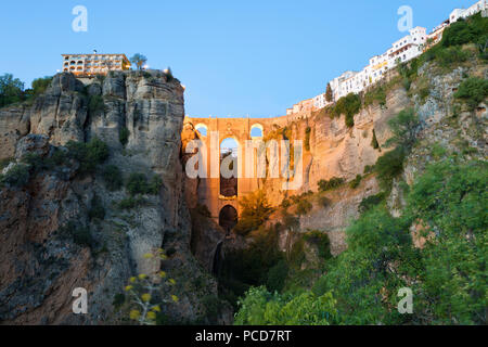 Puente Nuevo (New Bridge) floodlit at night and the white town perched on cliffs, Ronda, Andalucia, Spain, Europe Stock Photo