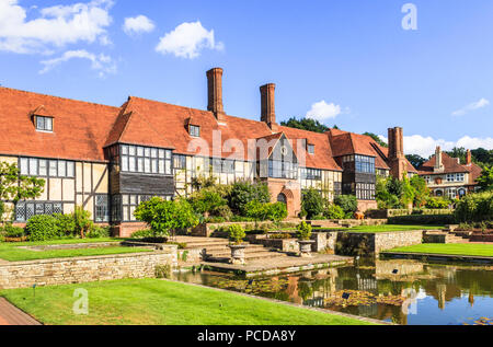 The historic Laboratory Building with reflections in the Jellicoe Canal, an iconic view at Royal Horticultural Society (RHS) Botanical Gardens, Wisley Stock Photo